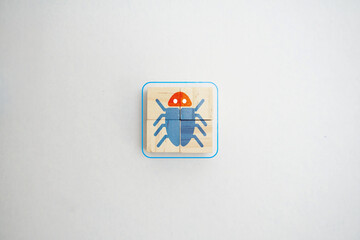 Network virus icon on wooden cube representing cyber threat concept