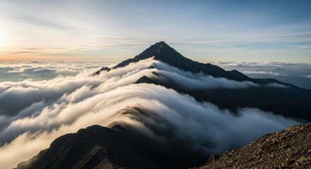 Majestic mountain peak piercing a sea of clouds at sunrise (1)