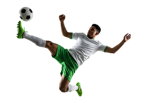 Soccer player kicking ball in mid air isolated on transparent background