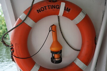 Nottingham Princess, England – August 16 2025: Orange lifebuoy with safety light on river cruise boat