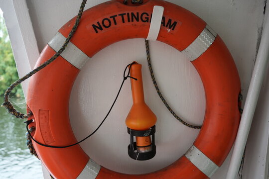 Nottingham Princess, England – August 16 2025: Orange lifebuoy with safety light on river cruise boat