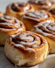 Fototapeta premium close up of glazed cinnamon rolls