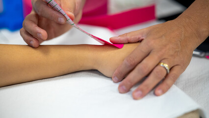 Obraz premium Wrapping elastic band around arm and wrist, physiotherapy