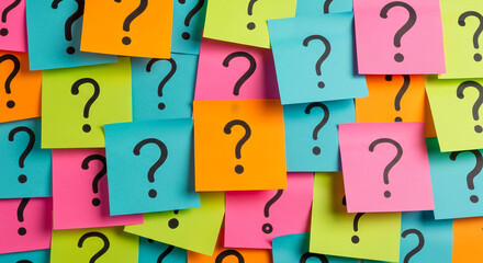 Colorful sticky notes with question marks, overlapping, creating a background of uncertainty and inquiry, symbolizing brainstorming, problem-solving, or decision-making