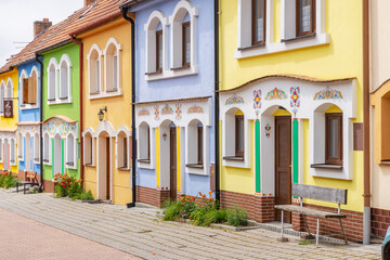 Colorful traditional houses standing in Prusanky, Czech Republic, showcasing vibrant facades and folk art