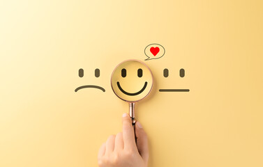 Mental Health Care and Positive Wellbeing Concept. A magnifying glass focuses on a happy, smiling...