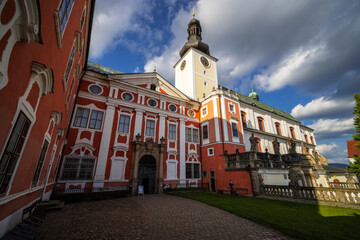 Naklejka premium Broumov Monastery standing tall under a cloudy sky in Czechia