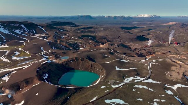 Venture into the stunning scenery of Krafla Crater, where vibrant azure waters meet unique volcanic formations. Experience the tranquility and geothermal wonders of Icelands natural beauty.