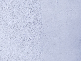 Textured wall painted in calming light blue. Abstract background representing division or change. Useful for design, architectural projects or as a neutral backdrop.