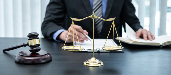 Male lawyer working with legal case document contract in office