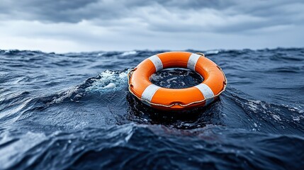 Life buoy ring on rough sea, stormy sky, life preserver in the ocean - concept of rescue and danger.