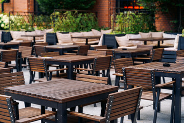 Outdoor wooden cafe tables and chairs
