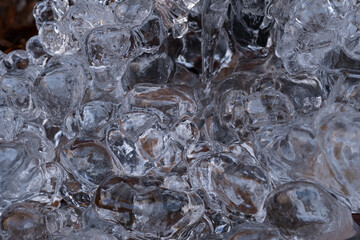 Natural ice crystals and frozen leaves close-up detail