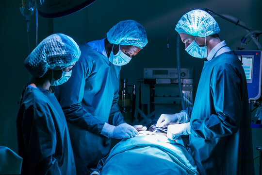 Team of surgeon doctors are performing heart surgery operation for patient from organ donor to save more life in the emergency surgical room