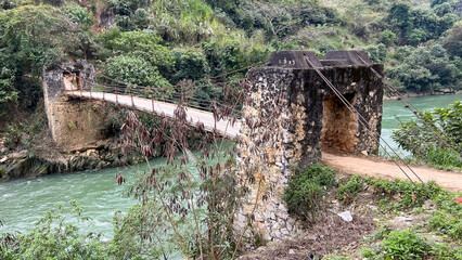 A Local Suspension Bridge Over Lo River In Ha Giang Province, Vietnam.