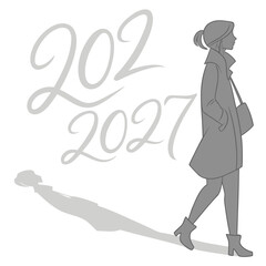 Stylish woman in coat and boots walks past the years 2022 and 2027 with her shadow stretching behind