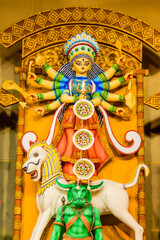 Fototapeta premium Durga Puja Festival Celebration in India. Goddess Durga Idol, Traditional Bengali Rituals, Colorful Pandal Decorations, Devotees Worship, Sindoor Khela, Dance, Festive Lights
