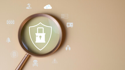 Cybersecurity and technology protection concept with magnifying glass focusing on padlock shield icon, representing secure data access, cyber threat detection, and IT security service solutions.