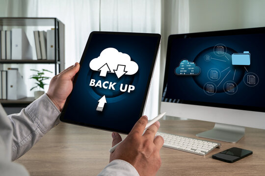Cloud technology backup concept with a person using a tablet showing cloud storage icons and data transfer, representing secure online file backup, data protection, and digital information management.