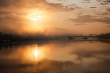 sunrise over the foggy river in Toruń © Przemylsaw Budzynski
