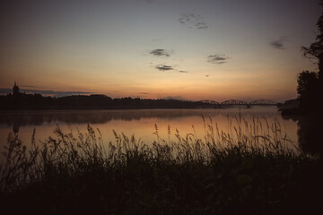 sunrise over the foggy river in Toruń © Przemylsaw Budzynski