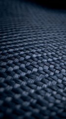 Extreme close up macro photograph of a woven textile material revealing the intricate details of the interlaced threads the textured surface pattern and the structural grid of the fabric