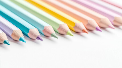 Naklejka premium Colorful pencils arranged in row, showcasing variety of vibrant shades. Perfect for artistic projects and creative expression