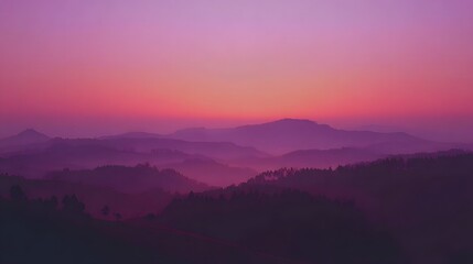 Fototapeta premium A serene vista of layered hills bathed in the vibrant hues of a tranquil sunrise.