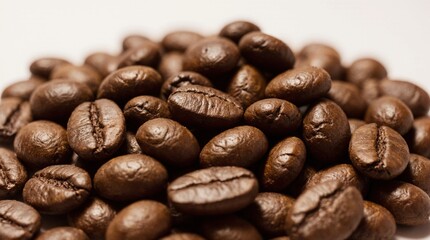 Close-up photo of roasted coffee beans with rich textures, natural oil sheen, and deep brown tones. Perfect for coffee packaging, branding, and cafe-related design projects.