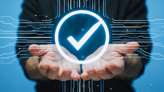 hands gently cradling a glowing blue holographic checkmark icon against a circuit-board-style digital background &mdash; symbolizing approval, validation, successful authentication, or system verification.