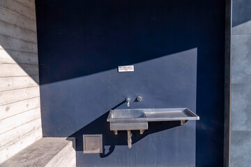 Exterior of a public bathroom sink at Jalama Beach campground in Lompoc, California.