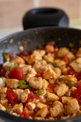 sauteed chicken with tomatoes	close up