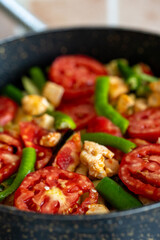 sauteed chicken with tomatoes	close up