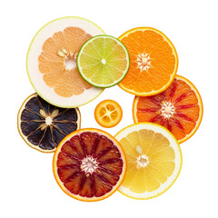 Obraz premium Assortment of freshly sliced citrus fruits on a white background