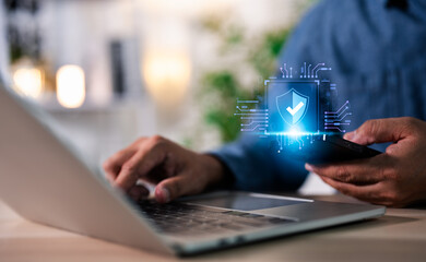 Hand of a man using mobile phone and laptop, secure access to user personal information, secure Internet access, information security encryption. Cybersecurity internet network data privacy concepts.