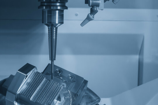 The 5-axis CNC milling machine finish cut the mold part with solid ball nose end mill tool in blue tone scene.