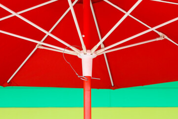 Close-up of a red umbrella on the color background