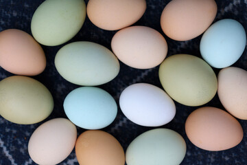 Organic color eggs random lay on the blue cloth