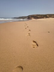 Footprints in the soft sand of  Portuguese coast along the Fishermen's trail