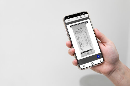 Smartphone with screen showing receipt of completed payment with copy space. Concept of electronic tax invoice, and online receipt for checking product list.