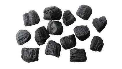 Arrangement of Charcoal Pieces on Transparent Backdrop with Rich Textures and Contrasting Shades