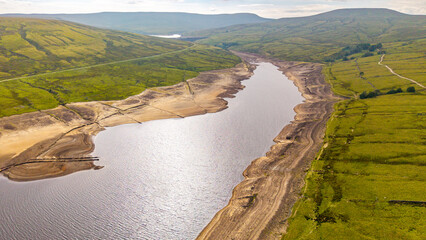 Drone photograph showing the very low water levels in Scar House Reservoir during the 2025 heatwave and drought. Months of below average rainfall  have left the reservoirs looking very dry.