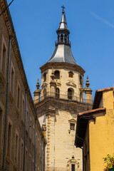 Fototapeta premium Bell Tower of Santa María Cathedral in Vitoria Seen from an Old Town Alley