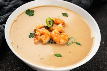 Tom kha soup shrimp, coconut milk, miso paste tasty seafood snack fresh delicious gourmet food background on the table rustic food top view copy space pescetarian diet