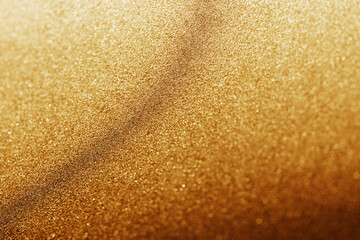 A radiant cascade of shimmering golden particles in soft focus.