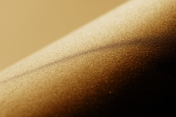 A radiant cascade of shimmering golden particles in soft focus.