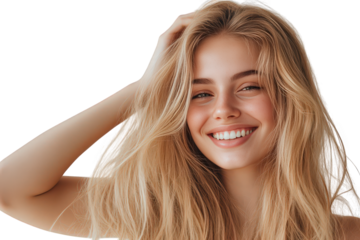 Happy young blonde woman with long wavy hair smiling and touching her hair isolated on transparent background