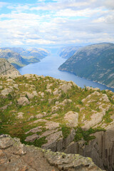 Aerial view of Purple and orange sunset scene of Oslofjord and mountain with people playing sup board in the water, Oslo, Norway