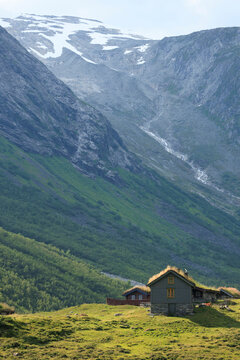 the seter houses up in the nordic rocky mountain with glacier in the background in summer Norway, travel experience