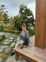 Fototapeta premium woman sitting on a bench